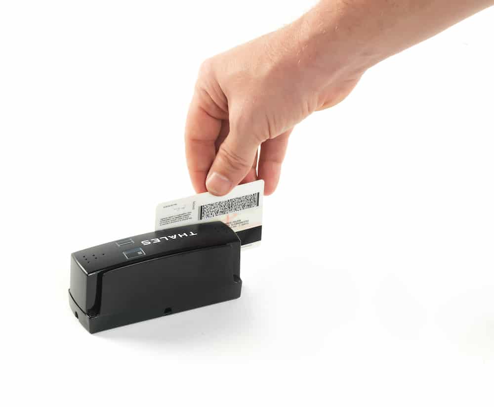 Person swiping ID on a Thales CR100M